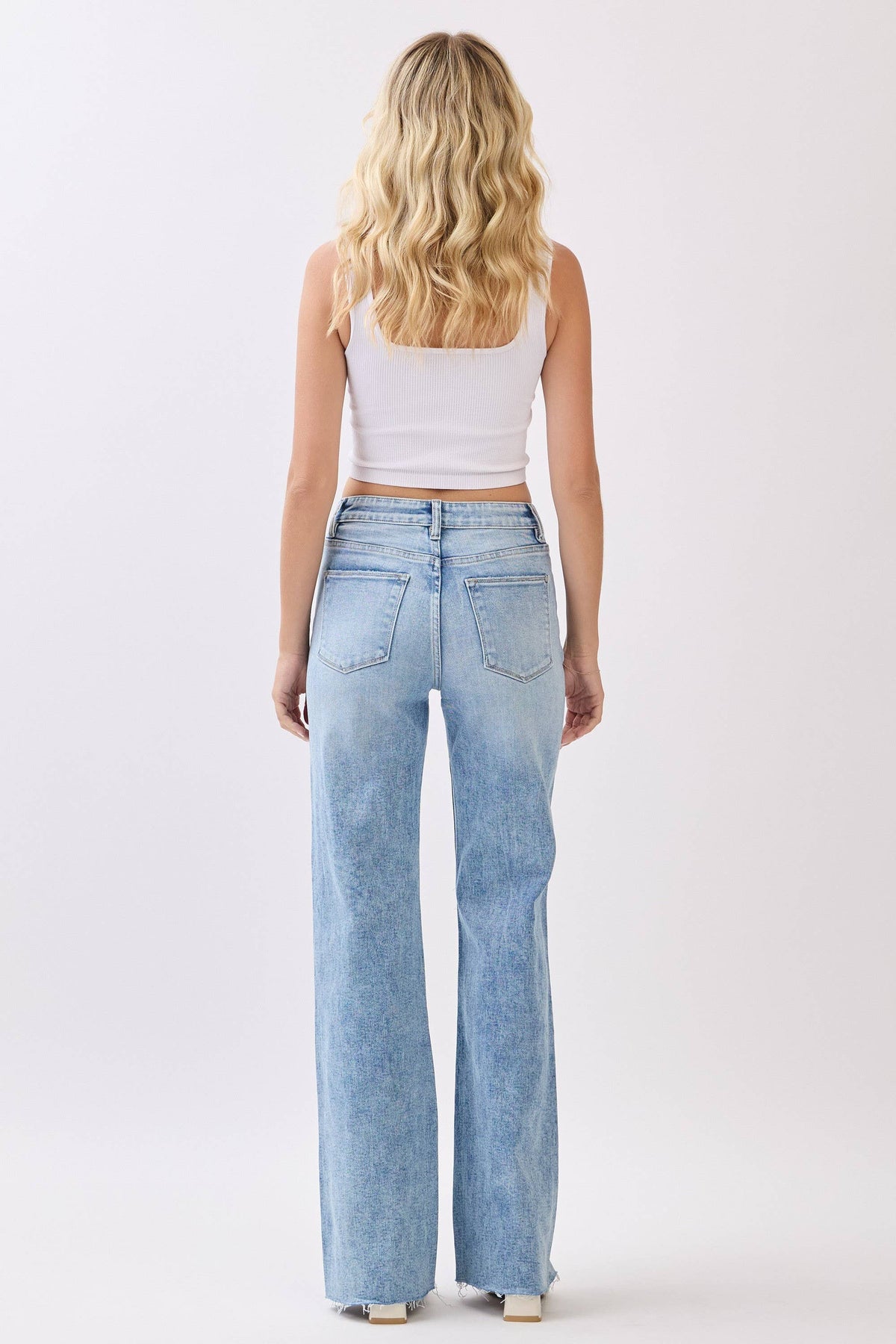 HIGH RISE STRETCH VINTAGE FLARE W/ RAW HEM JEANS