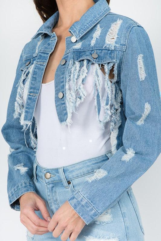 Distressed denim jacket and matching jeans for women's fashion, styled with a white top for casual or vacation outfits.